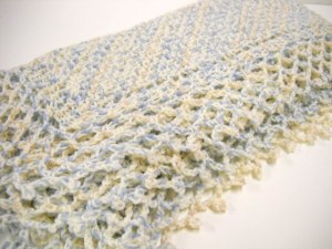 Finished the knitting & now 'off the hook' with the crocheted border complete