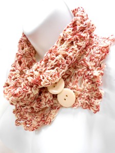 Lacy, open work, crocheted cowl in creme and rose.